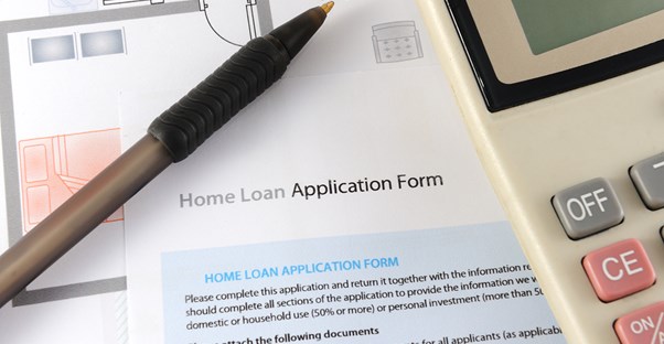 A home loan application sitting on the desk of a home buyer.