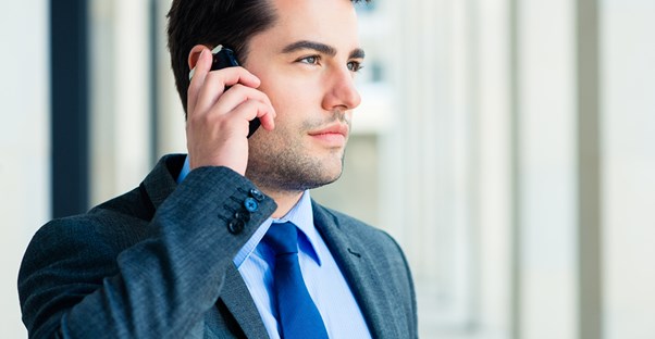 A business owner talks to his business phone service to guarantee he is getting the most out of his service.