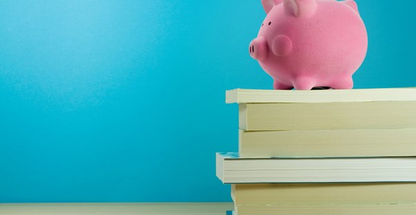 Piggy bank on stack of books