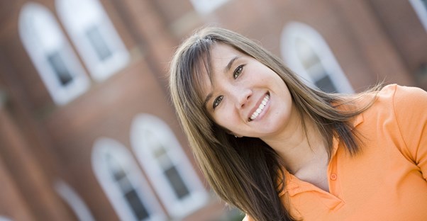 Smiling Woman Who Use Student Loan Forgiveness