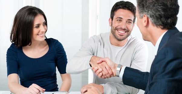 Couple meeting with a life coach or financial advisor