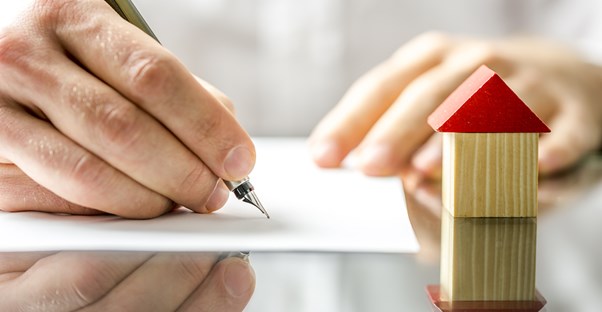 Person filling out an application for a home equity loan