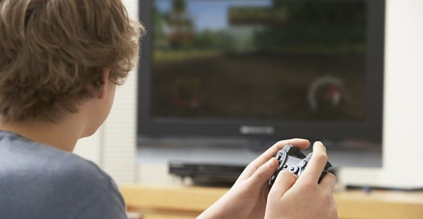 Teen boy playing video games