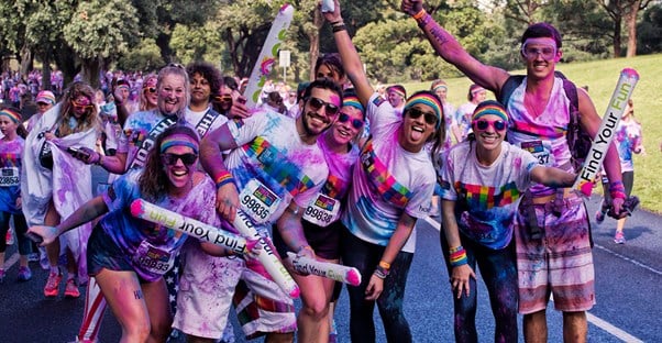 Group of people at a color run, a unique fundraiser.