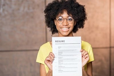 woman holding up resume