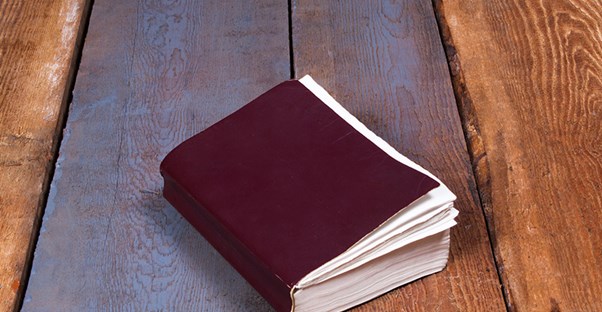 a notebook that belongs to a pastor with a theology degree