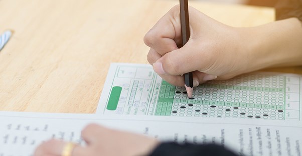 a student fills out an lsat test sheet
