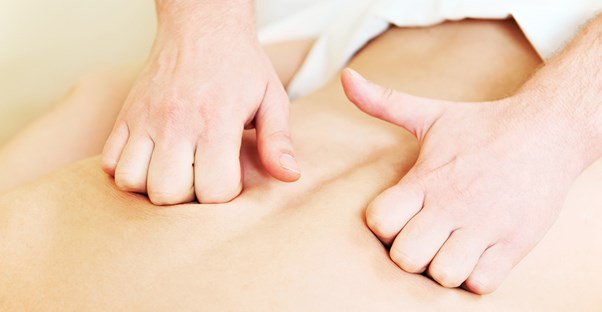 Massage therapist practicing after graduating massage therapy school
