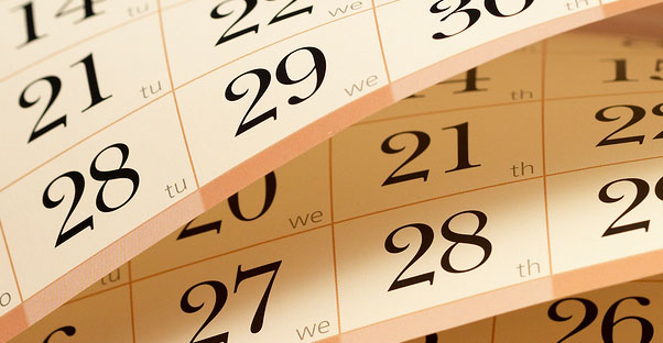 Pages of a calendar are being flipped.