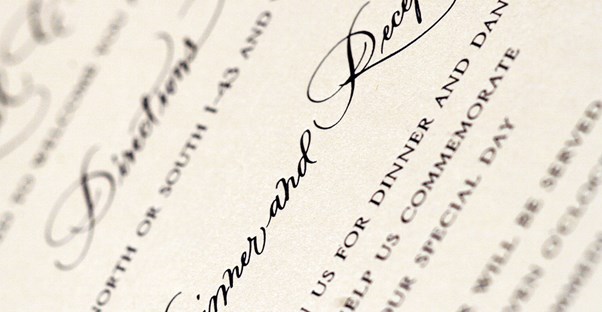 Close up of a wedding invitation that followed etiquette