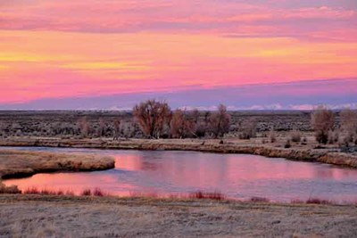 a pink sunset on the open expanse of wyoming