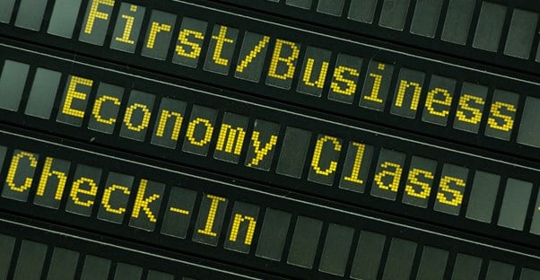 an airline message board that says first/business and economy class check-in
