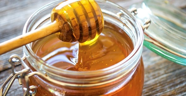 jar of honey as a home remedy for cough suppression