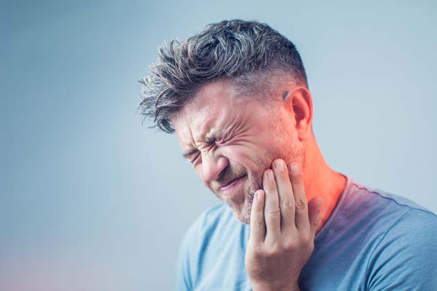 Headache Powder on Gums for a Toothache