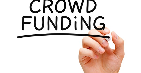 the word crowdfunding written on a white board