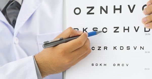 an eye doctor preparing his patient for lasik eye surgery