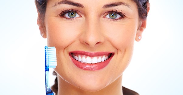 a woman who follows natural teeth whitening tips