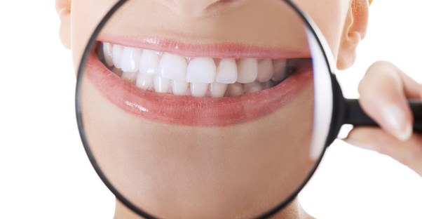 a woman who is aware of the dangers of teeth whitening