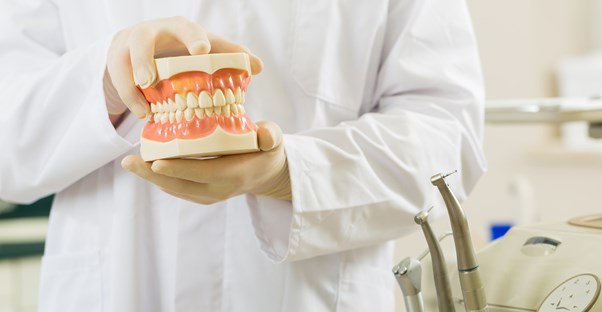 a dentist who understands the differences between full and partial dentures