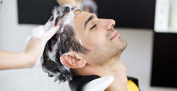 A hair restoring shampoo cures a mans baldness