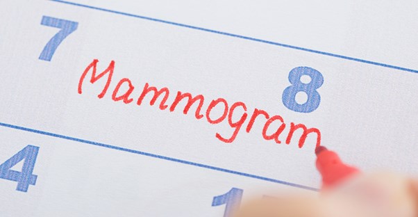 A woman schedules a mammogram